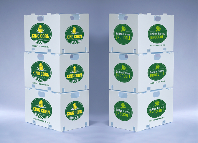 Stacks of white plastic corrugated containers for TCC King Corn and Bolton Farms Broccoli, showcasing reusable packaging for produce grown in the USA.