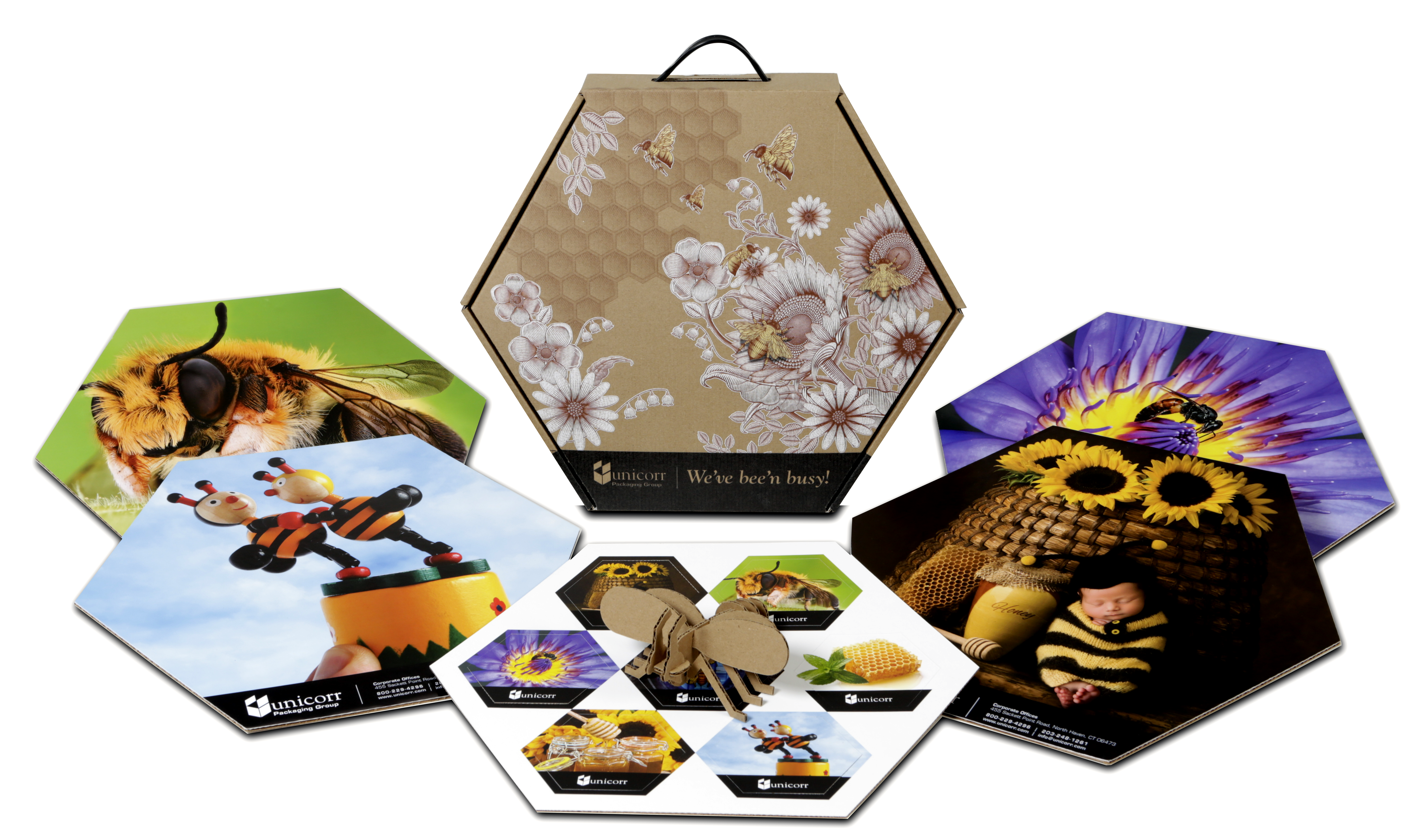 Hexagonal custom printed boxes and promotional displays featuring bees and flowers.